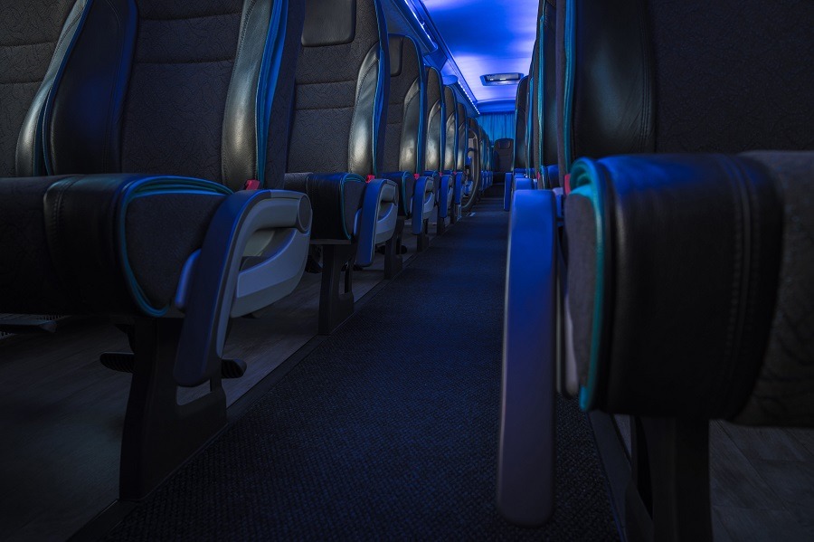 the inside of an empty chartered bus